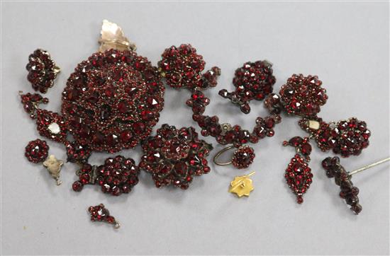A group of assorted late Victorian garnet set jewellery including pendants, studs, etc.